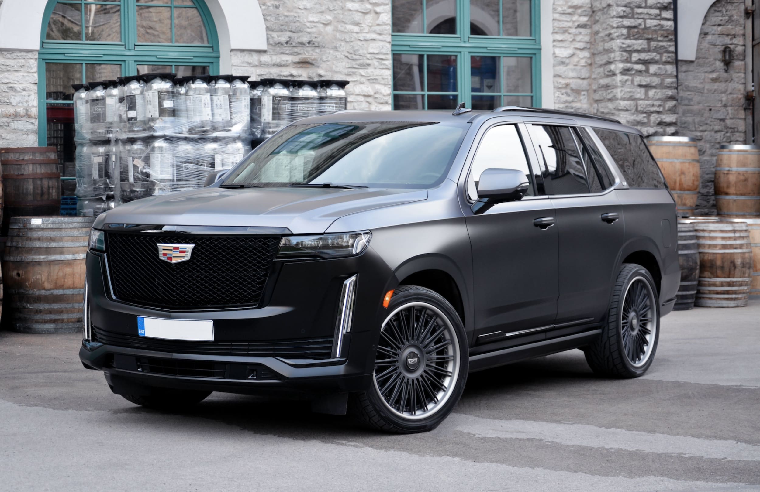 Front three-quarter view of a custom Cadillac Escalade with 24-inch Vossen wheels
